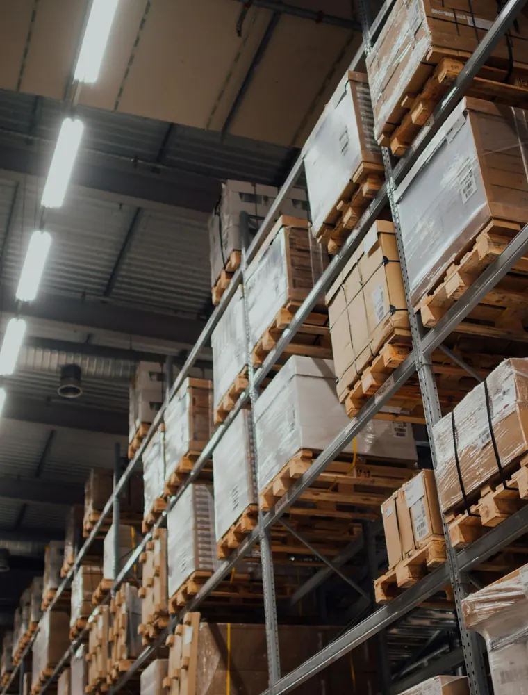 Pallets of cartons stacked on warehouse racking