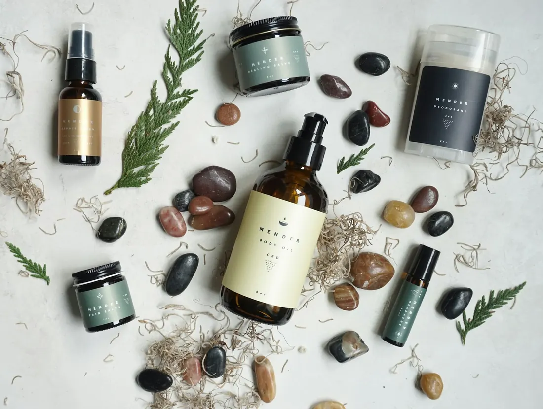 Skincare bottles and jars arranged with botanicals