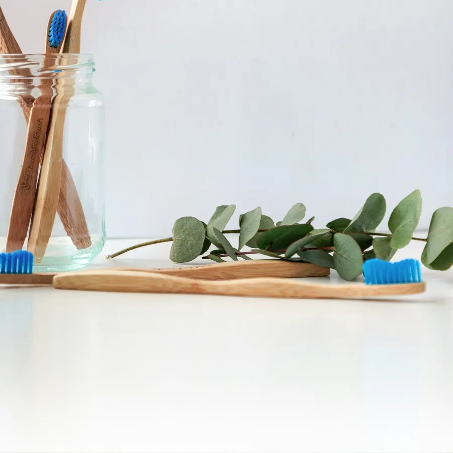 Personal care items arranged on a pale surface